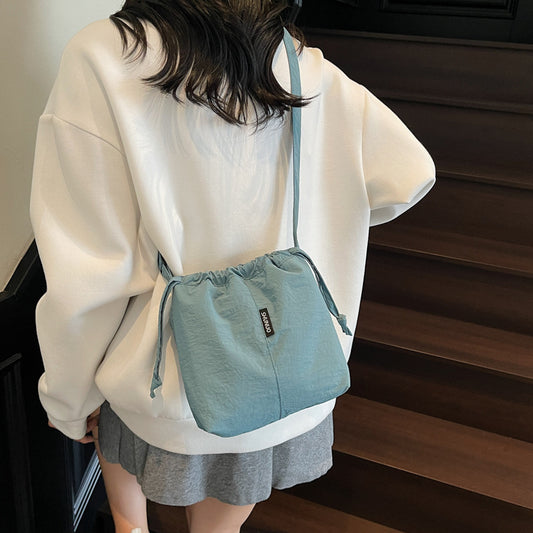 Summer casual versatile drawstring Oxford cloth bucket bag, women's 2025 new niche artistic crossbody bag, mobile phone bag