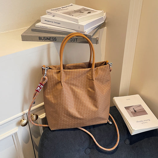 2025 new grid pattern waterproof nylon shoulder bag for women, large capacity water bucket bag, tote bag, urban leisure commuting crossbody bag