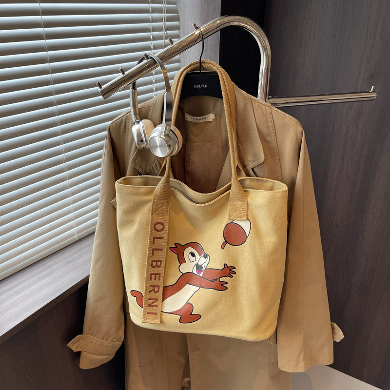 Simple and versatile trendy cartoon cat canvas bag for women 2025 new large capacity commuting hand-held shoulder tote bag