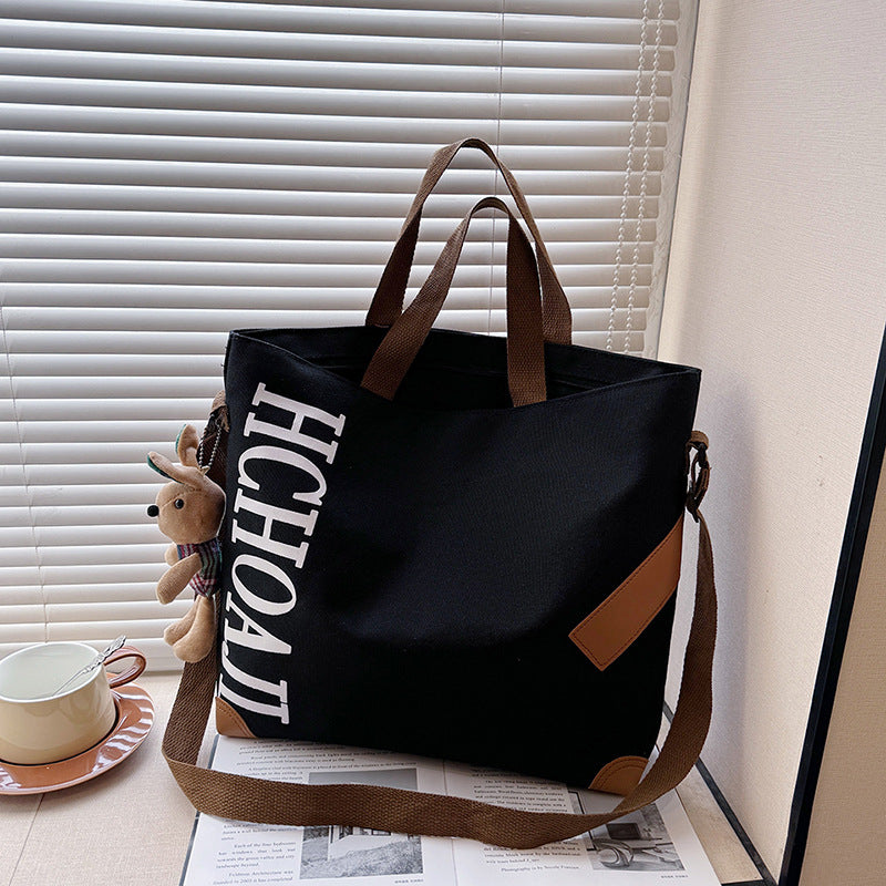 Outdoor canvas bag, women's high-end sense, large capacity tote bag, student class niche ins crossbody shoulder bag