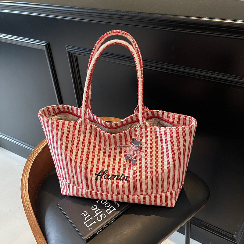 Striped canvas handbag for women in spring and summer 2025, large capacity tote bag, commuting shoulder bag, travel bag