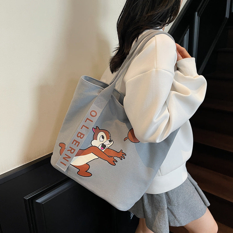 Simple and versatile trendy cartoon cat canvas bag for women 2025 new large capacity commuting hand-held shoulder tote bag