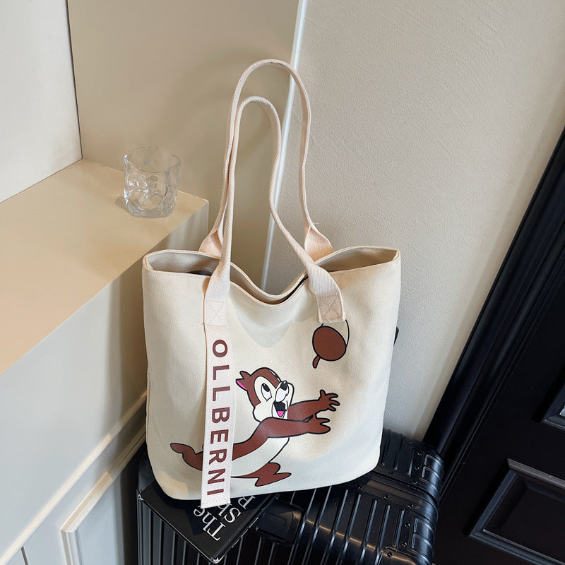 Simple and versatile trendy cartoon cat canvas bag for women 2025 new large capacity commuting hand-held shoulder tote bag