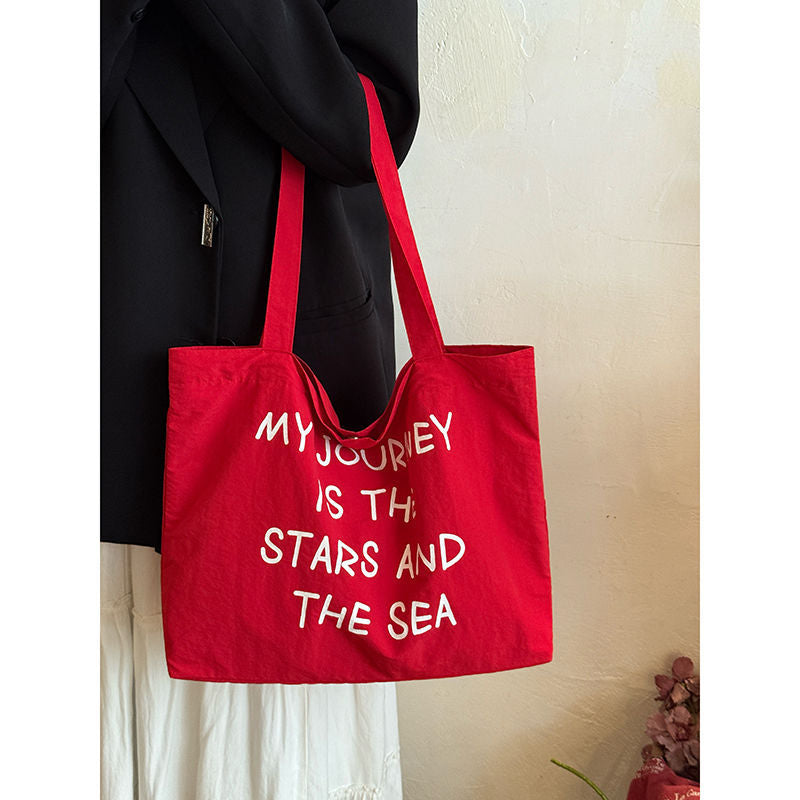 2025 new autumn and winter large capacity canvas bag, women's new lazy style work commuting shoulder bag, niche versatile tote bag