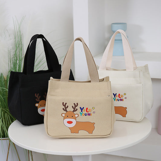 2025 New Cartoon Printed Handbag Large Capacity Simple Fashion Tote Bag Multi functional Makeup Bag
