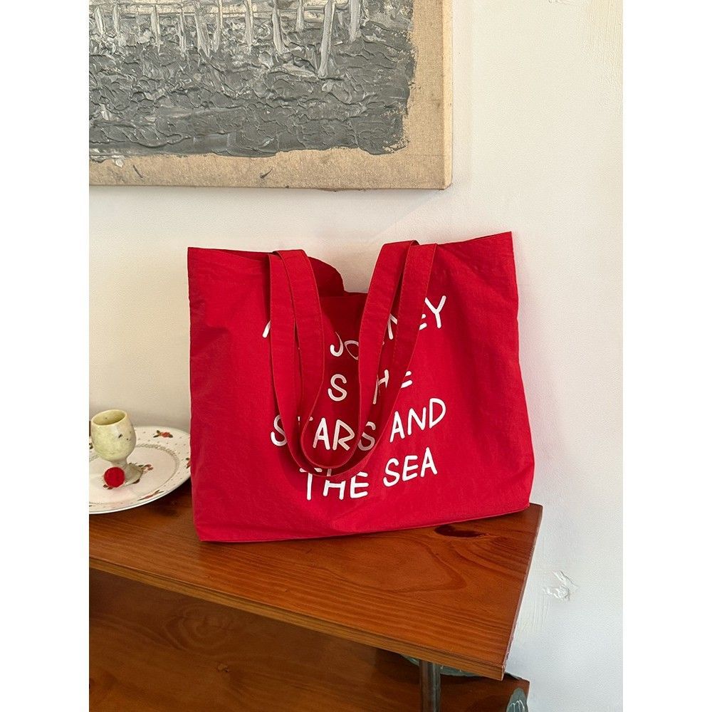 2025 new autumn and winter large capacity canvas bag, women's new lazy style work commuting shoulder bag, niche versatile tote bag