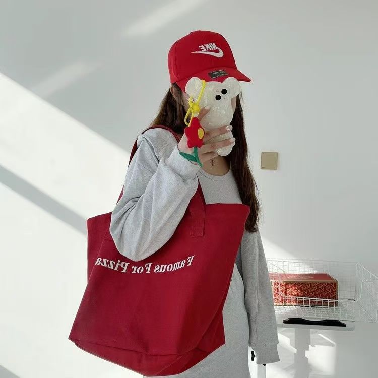 Small niche red canvas bag 2025 new casual letter printed canvas shoulder bag large capacity student tote bag