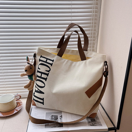 Outdoor canvas bag, women's high-end sense, large capacity tote bag, student class niche ins crossbody shoulder bag