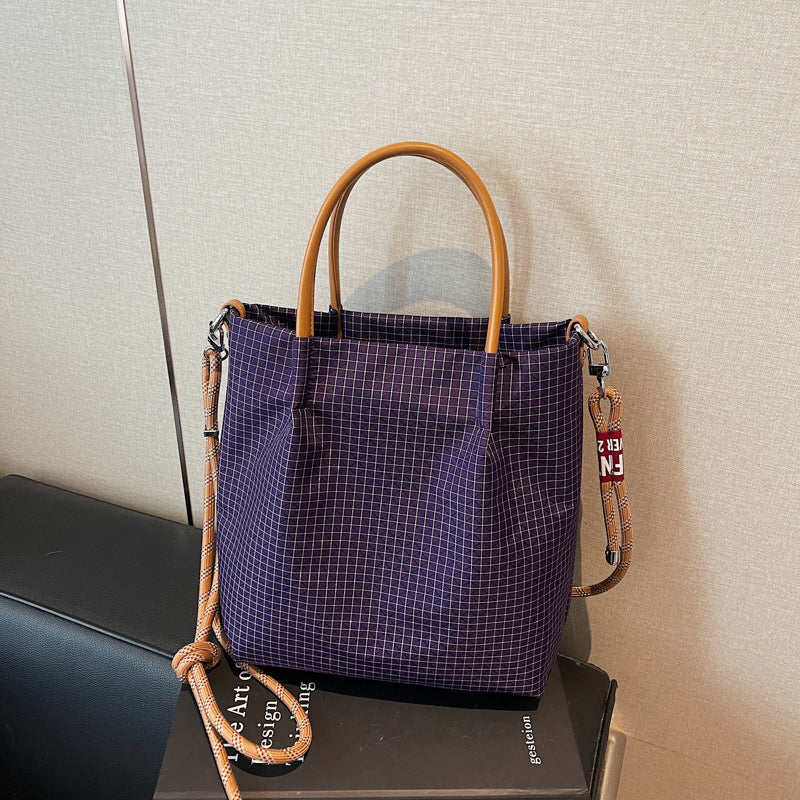 2025 new grid pattern waterproof nylon shoulder bag for women, large capacity water bucket bag, tote bag, urban leisure commuting crossbody bag