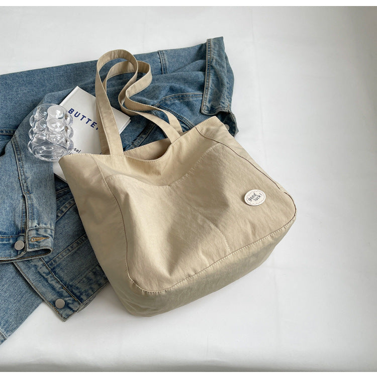 High end canvas bag for women, large capacity, new design for autumn and winter 2025, Japanese students' simple class commuting shoulder bag