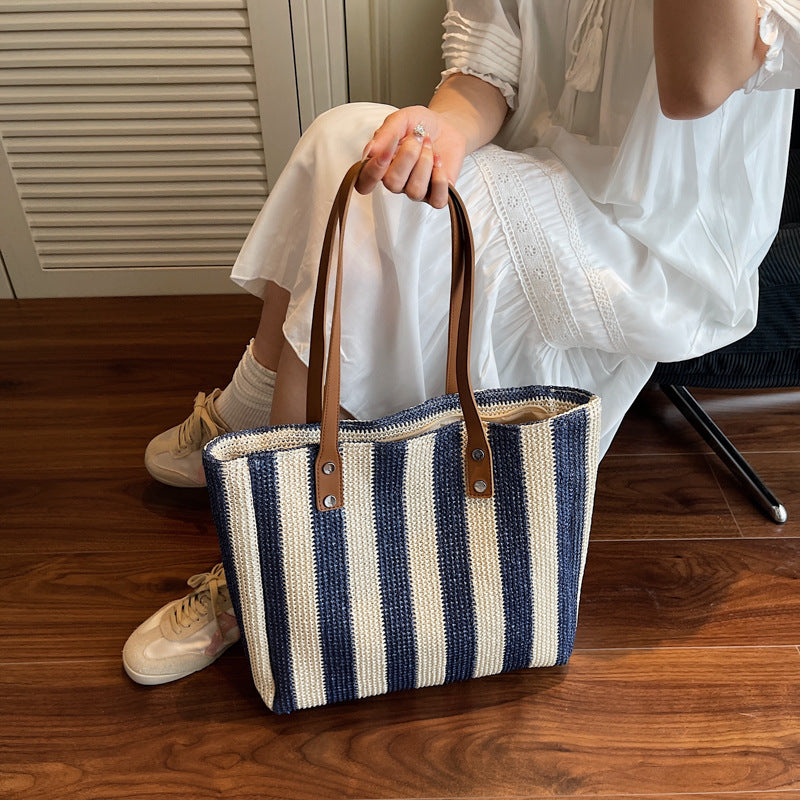 Large capacity fashionable hand-held woven bag for women's cross-border new Korean version striped shoulder bag for vacation and leisure beach bag