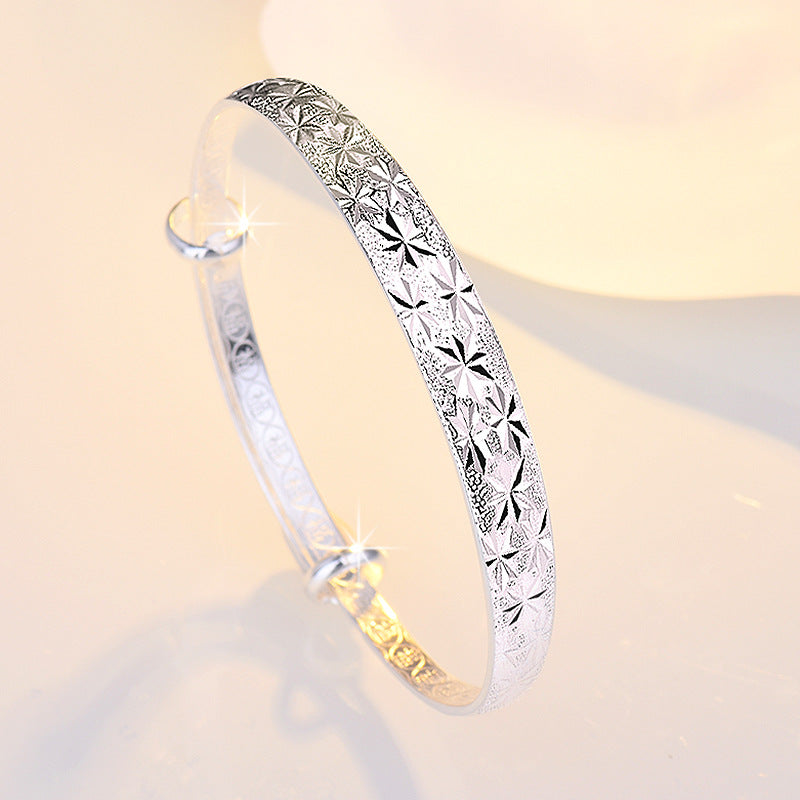 Graceful Star-Engraved Silver Bangle for Women