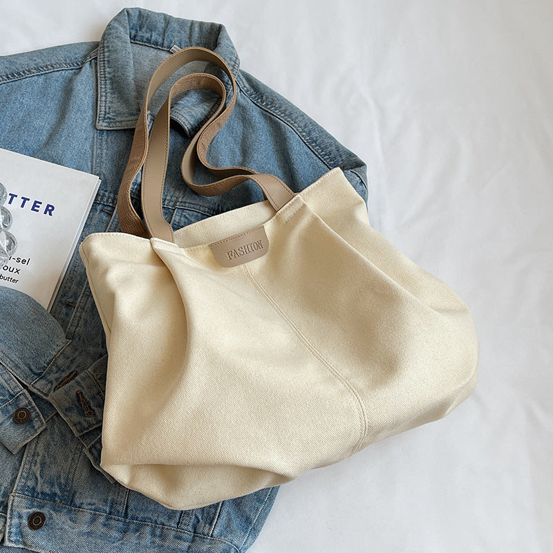 Large capacity canvas bag for women in autumn and winter 2025, fashionable and casual single shoulder handbag, student class commuting tote bag