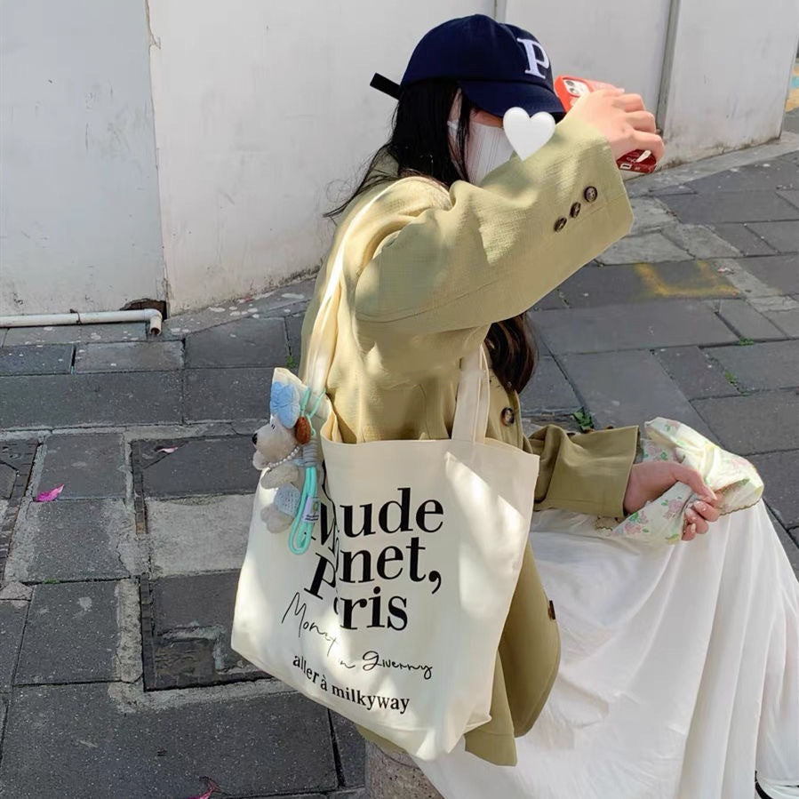 2025 new minimalist letter canvas bag, casual and versatile commuting shoulder bag, female student tote bag