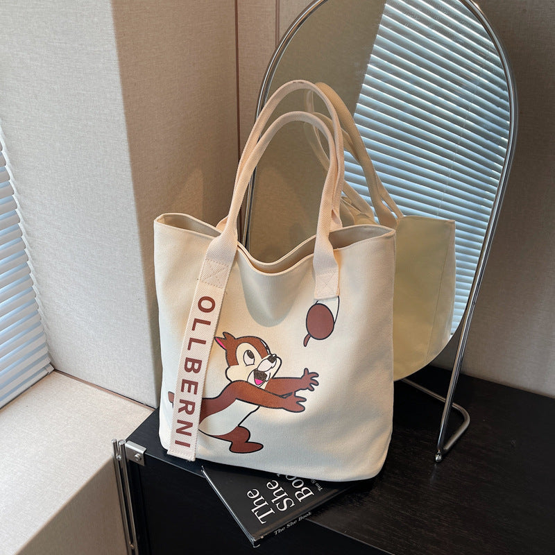 Simple and versatile trendy cartoon cat canvas bag for women 2025 new large capacity commuting hand-held shoulder tote bag