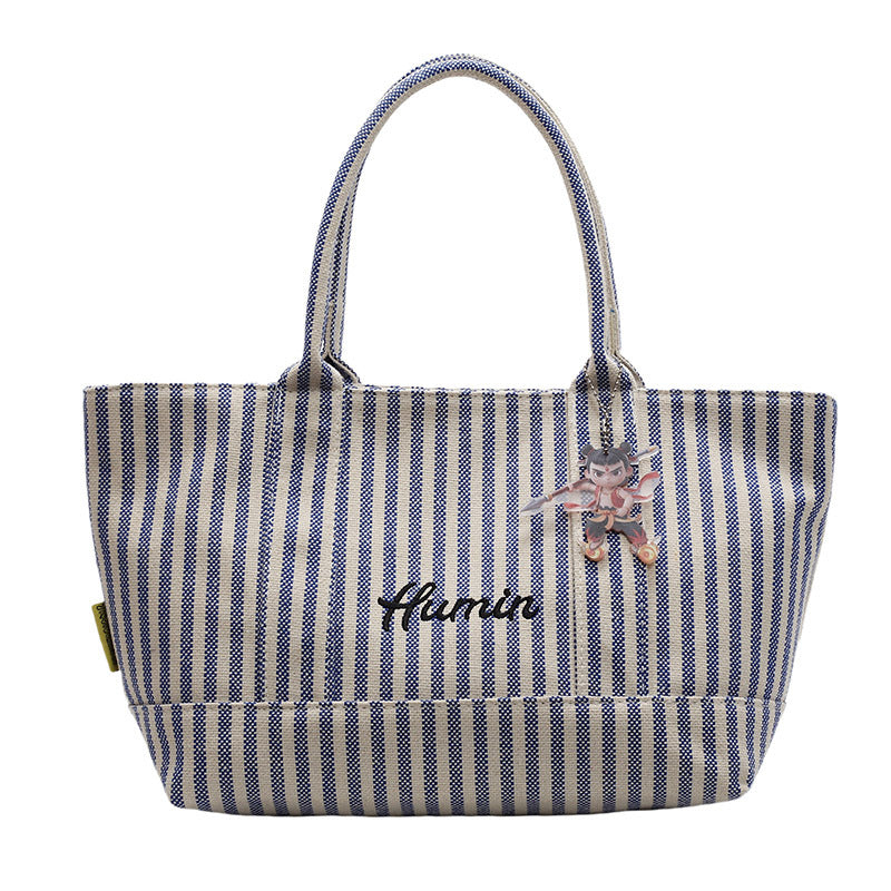 Striped canvas handbag for women in spring and summer 2025, large capacity tote bag, commuting shoulder bag, travel bag