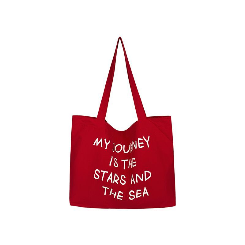 2025 new autumn and winter large capacity canvas bag, women's new lazy style work commuting shoulder bag, niche versatile tote bag