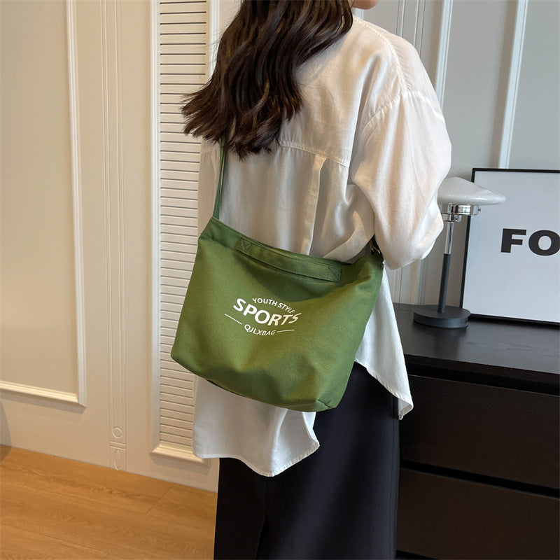 2025 new solid color letter printed canvas trendy and personalized daily simple women's bag shoulder bag crossbody bag vertical women's bag