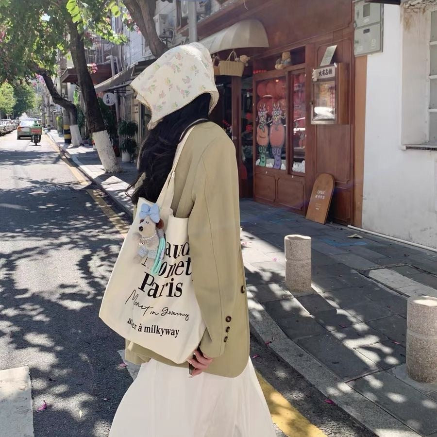 2025 new minimalist letter canvas bag, casual and versatile commuting shoulder bag, female student tote bag