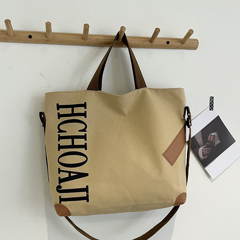 Outdoor canvas bag, women's high-end sense, large capacity tote bag, student class niche ins crossbody shoulder bag