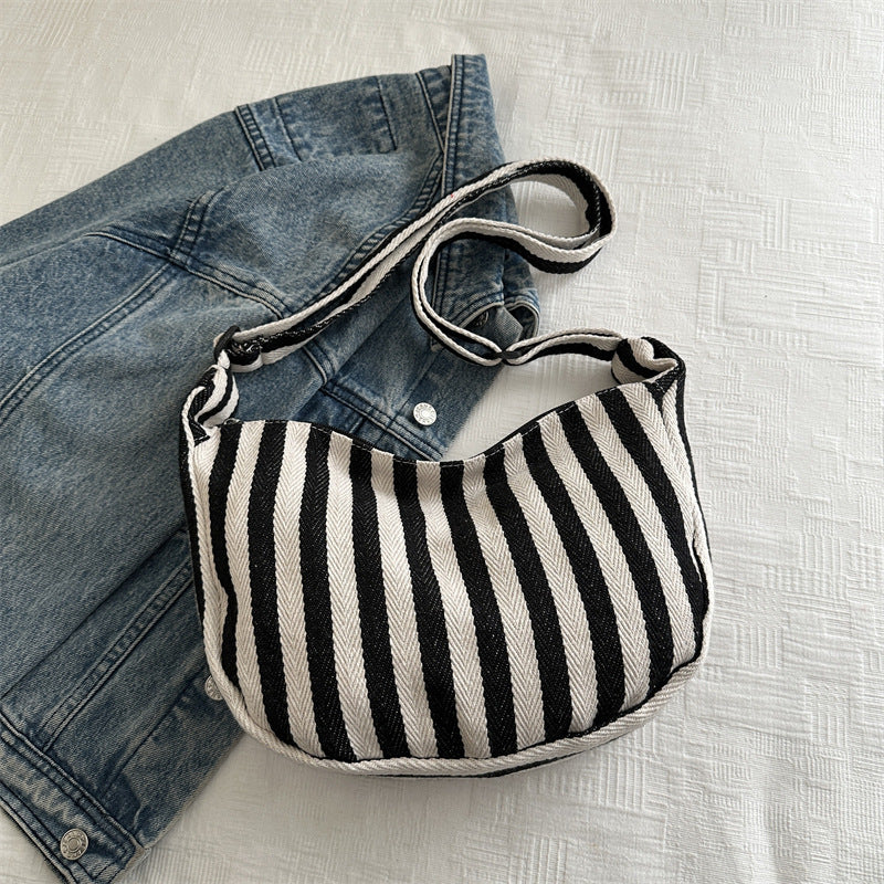 Korean version of small fresh contrasting striped shoulder bag, large capacity tote bag, new single shoulder armpit bag, artistic crossbody bag