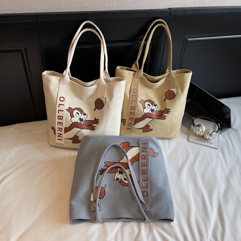 Simple and versatile trendy cartoon cat canvas bag for women 2025 new large capacity commuting hand-held shoulder tote bag