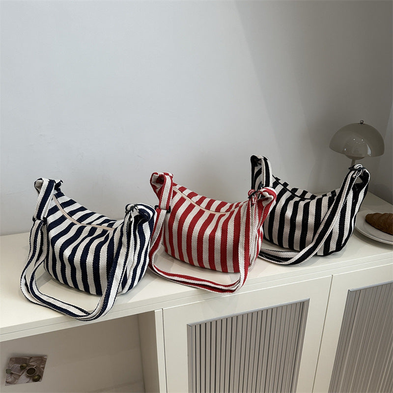 Korean version of small fresh contrasting striped shoulder bag, large capacity tote bag, new single shoulder armpit bag, artistic crossbody bag