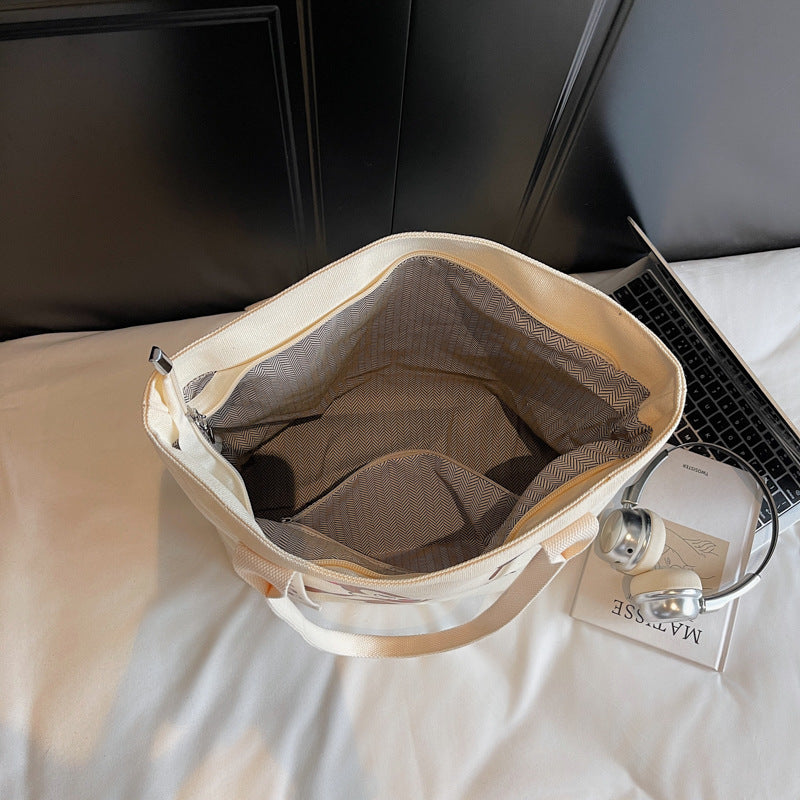 Simple and versatile trendy cartoon cat canvas bag for women 2025 new large capacity commuting hand-held shoulder tote bag