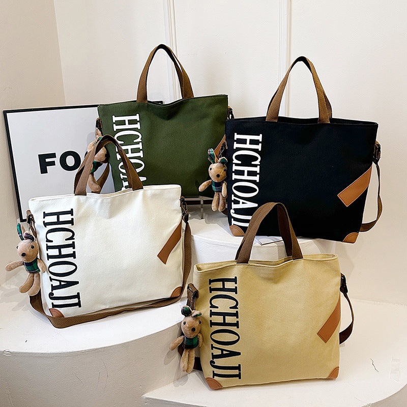 Outdoor canvas bag, women's high-end sense, large capacity tote bag, student class niche ins crossbody shoulder bag