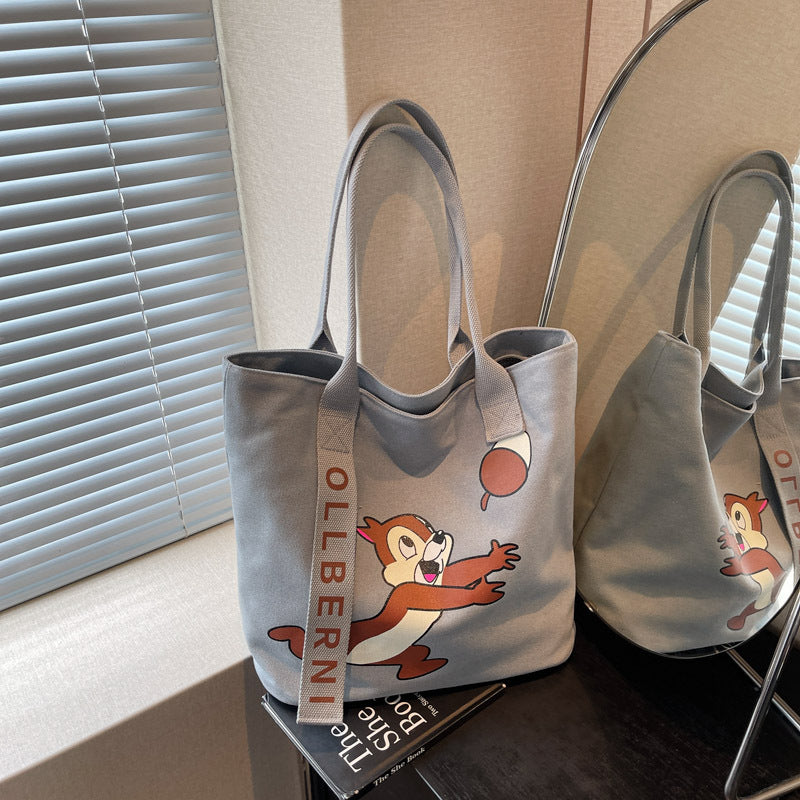 Simple and versatile trendy cartoon cat canvas bag for women 2025 new large capacity commuting hand-held shoulder tote bag