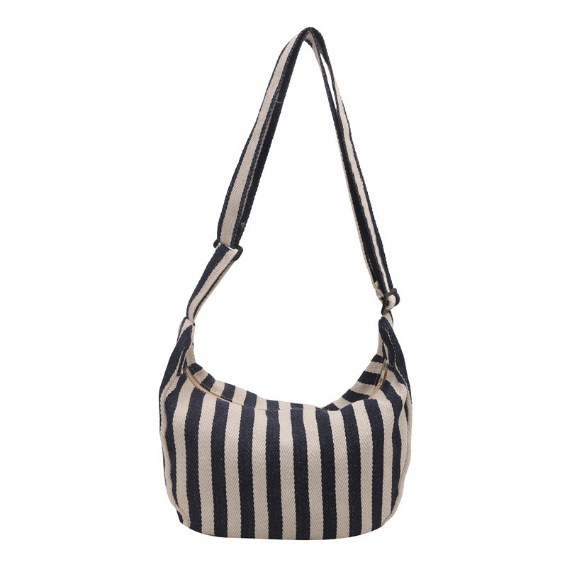 Korean version of small fresh contrasting striped shoulder bag, large capacity tote bag, new single shoulder armpit bag, artistic crossbody bag