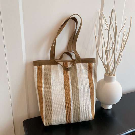 2025 New Stripe Contrast Handheld Women's Bag Large Capacity Fashion Commuter Versatile Shoulder Bag Knitted Fabric Korean Edition Tote Bag