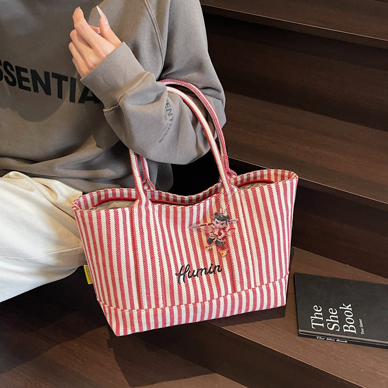 Striped canvas handbag for women in spring and summer 2025, large capacity tote bag, commuting shoulder bag, travel bag