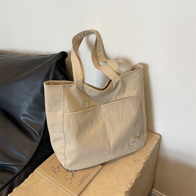 High end canvas bag for women, large capacity, new design for autumn and winter 2025, Japanese students' simple class commuting shoulder bag
