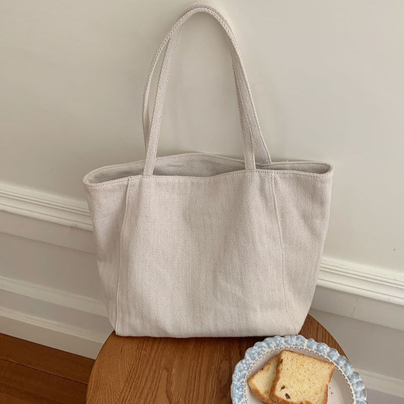 Women's 2025 new large capacity tote bag, Korean version twill canvas bag, commuting single shoulder hand-held casual women's bag