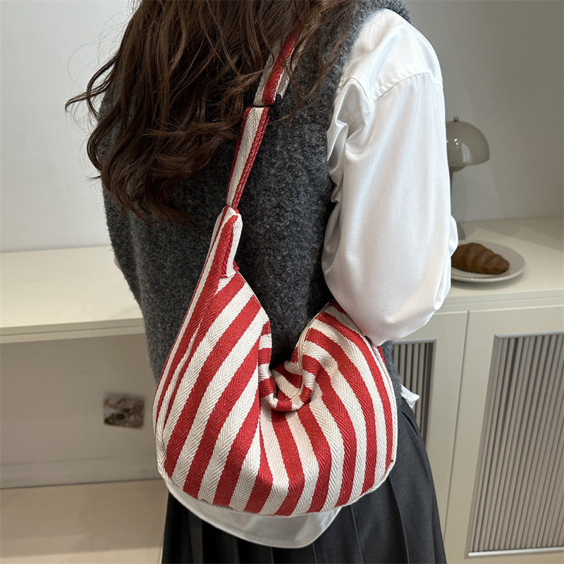 Korean version of small fresh contrasting striped shoulder bag, large capacity tote bag, new single shoulder armpit bag, artistic crossbody bag