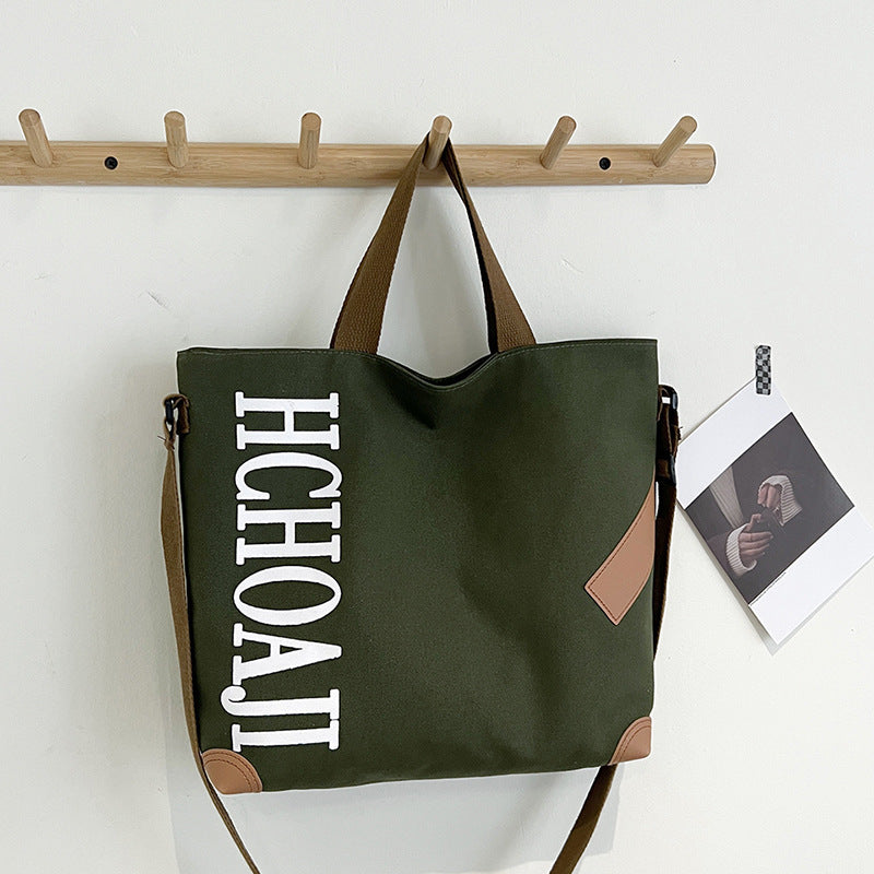 Outdoor canvas bag, women's high-end sense, large capacity tote bag, student class niche ins crossbody shoulder bag