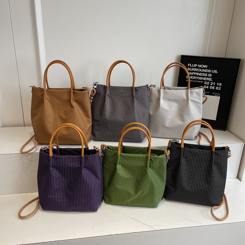 2025 new grid pattern waterproof nylon shoulder bag for women, large capacity water bucket bag, tote bag, urban leisure commuting crossbody bag