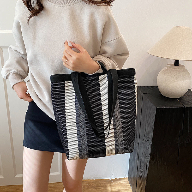 2025 New Stripe Contrast Handheld Women's Bag Large Capacity Fashion Commuter Versatile Shoulder Bag Knitted Fabric Korean Edition Tote Bag